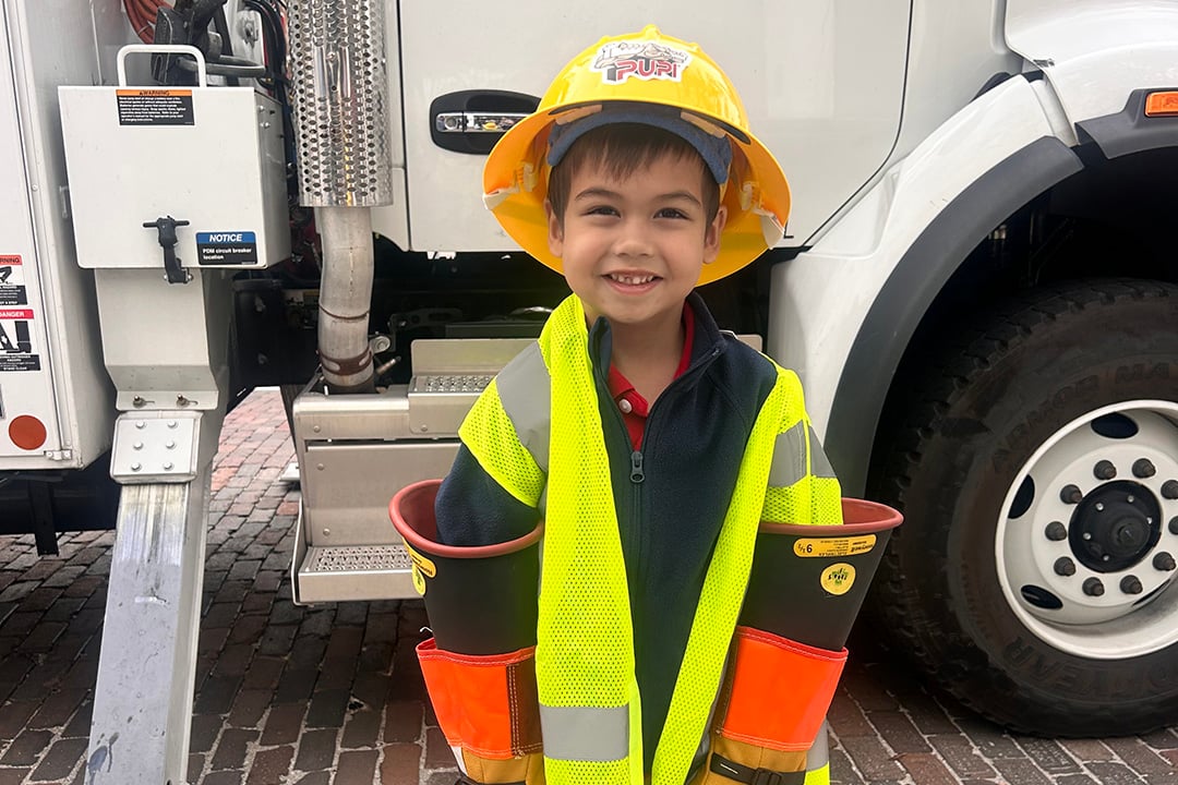 Little Lineworker, Big Surprise: Meet Ezra, Our Youngest TECO Fan!
